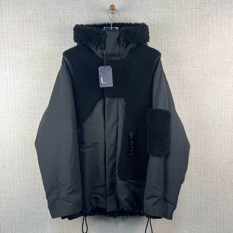 Louis Vuitton / Cotton-blend hooded jacket with wool paneling, chain detail, and zip fastening. - 1
