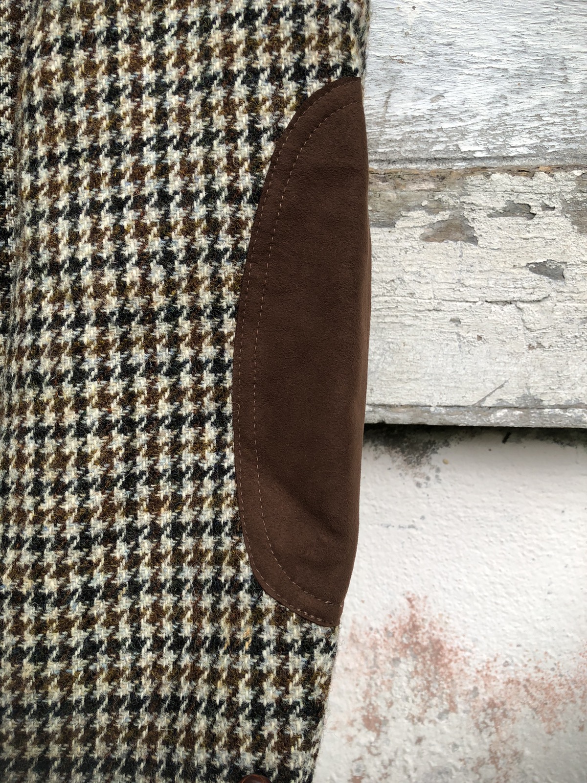 Tweed coat with leather elbow patches.