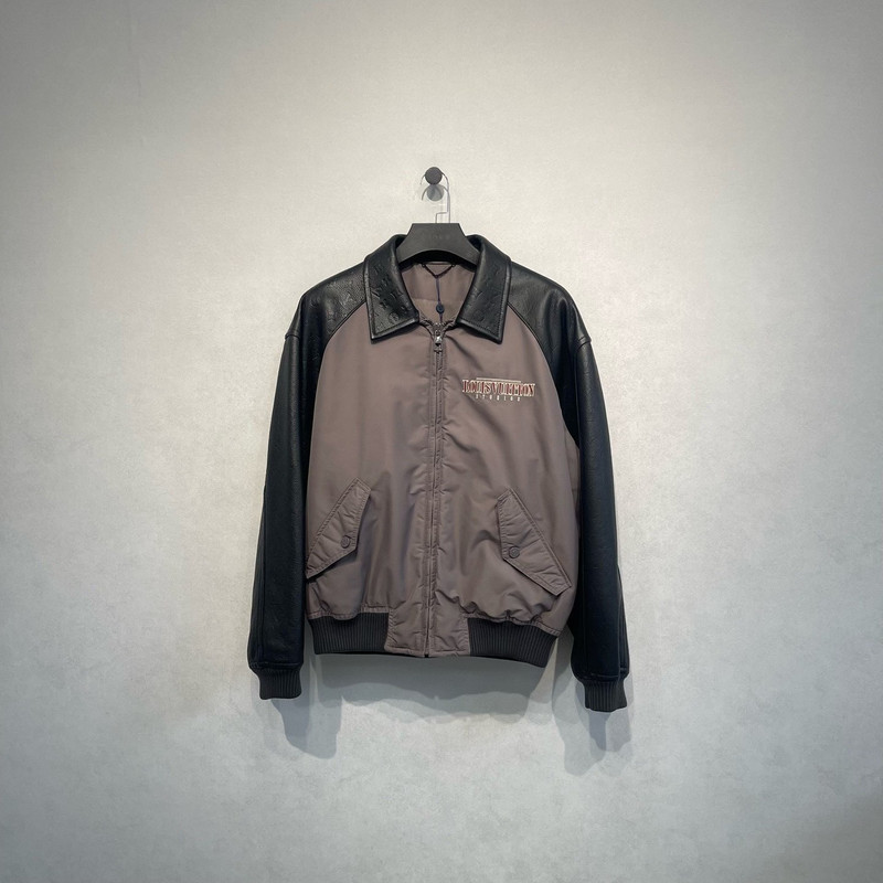 Louis Vuitton gray baseball jacket with embossed logo and leather paneling. - 1