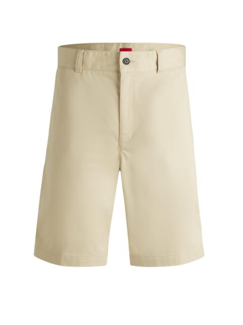 HUGO REGULAR-FIT SHORTS WITH SLIM LEG AND BUTTONED POCKETS