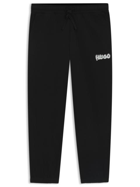 HUGO COTTON-TERRY TRACKSUIT BOTTOMS WITH LOGO PRINT