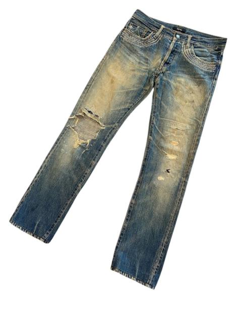 UNDERCOVER Undercover distressed with poem jeans