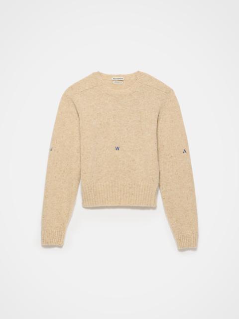 JW Anderson EMBROIDERED CREW NECK JUMPER IN OATMEAL MELANGE