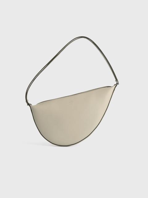 TOTEME Leather scooped sling fawn