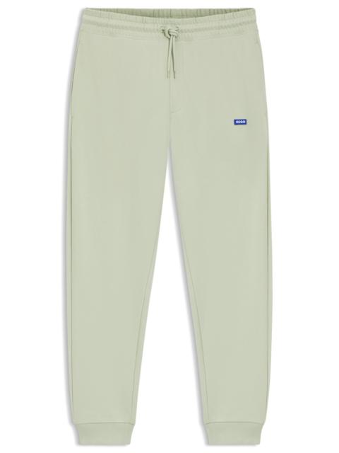 HUGO COTTON-TERRY SWEATPANTS WITH LOGO PATCH