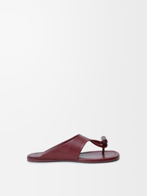 Loewe Toggle flat sandal in shiny smoot calfskin