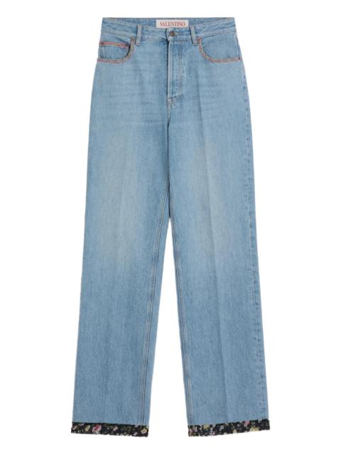Valentino floral-trim jeans