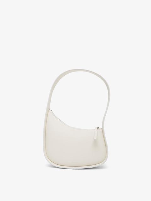 The Row Half Moon ivory leather bag