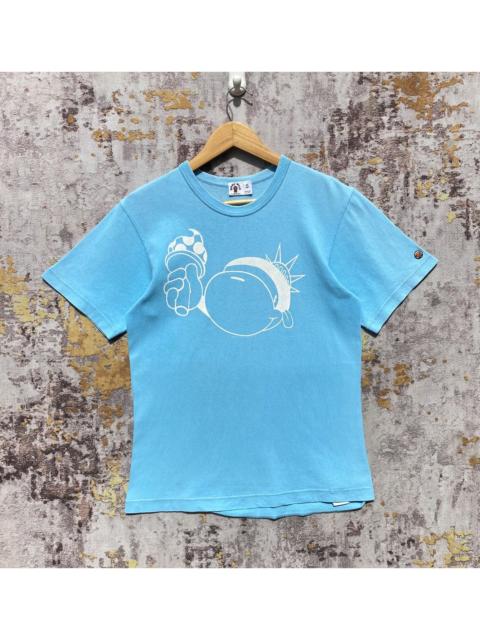 A BATHING APE® BAPE NYC15 Anniversary Baby Milo Statue of Liberty Shirt