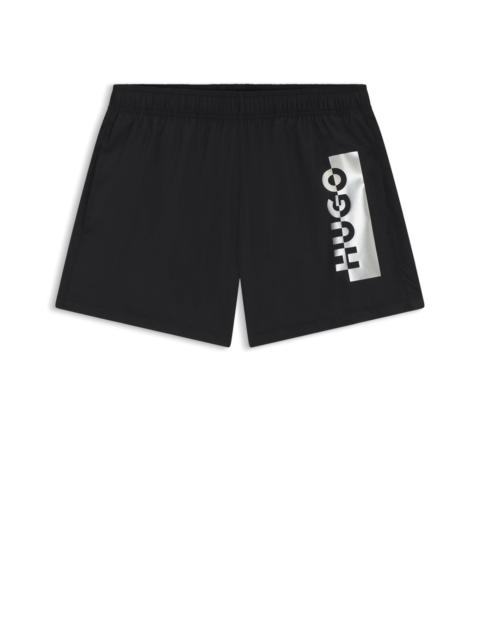 HUGO SWIM SHORTS WITH METALLIC SPLIT LOGO