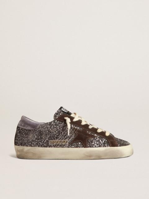 Golden Goose Super-Star in glitter with a brown star and lilac heel tab