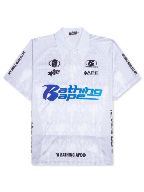 A BATHING APE® FLAME PATTERN OVERALL PRINT HALF ZIP RELAX FIT POLO SHIRT - WHITE