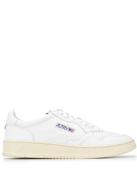 AUTRY Experience the elegance of the "MEDALIST LOW" LEATHER SNEAKERS by AUTRY, a timeless addition to your