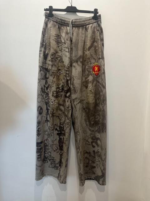 BALENCIAGA Balenciaga Graffiti Print Distressed Track Pants