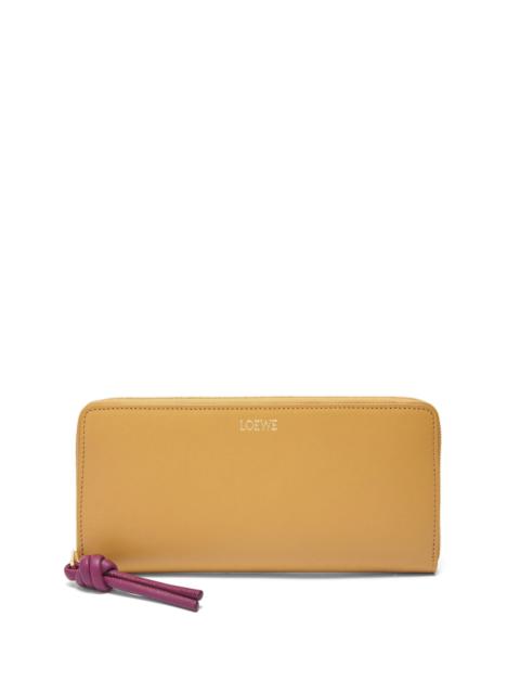 Knot zip around wallet in shiny nappa calfskin