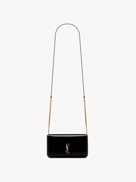 SAINT LAURENT CASSANDRE PHONE HOLDER IN PATENT LEATHER