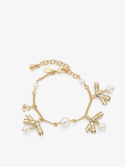 JIMMY CHOO Multi Charm Ribbon  Bracelet
Gold Metal Charm Bracelet with Ribbons & Pearls