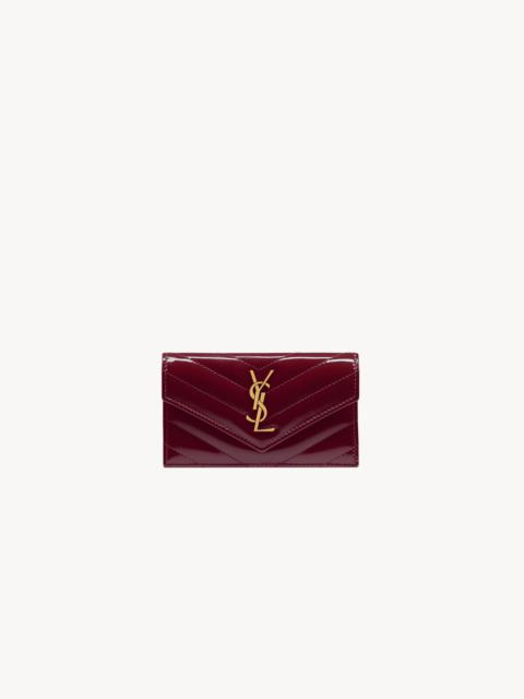 SAINT LAURENT CASSANDRE MATELASSÉ FRAGMENTS FLAP CARD CASE IN PATENT LEATHER