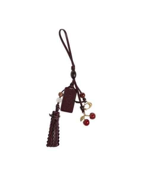 COACH logo-engraved leather bag charm