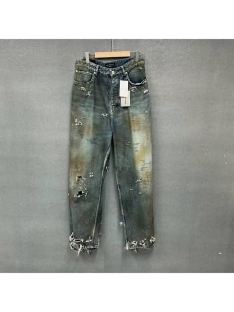 BALENCIAGA Balenciaga distressed jeans with a muddy, faded finish.