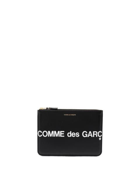 Comme Des Garçons Leather pouch with logo