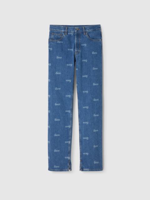 Denim pant with lasered Gucci detail