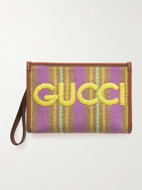 Leather-trimmed embroidered raffia pouch