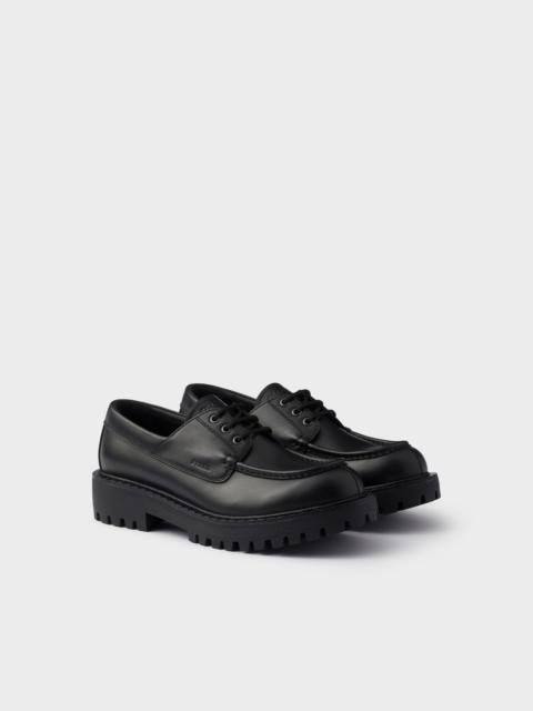 Prada Laced leather loafers