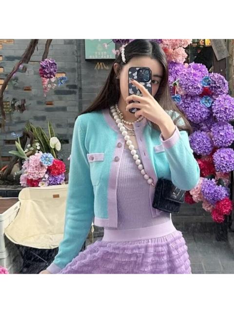 CHANEL Chanel 24C blue and purple color-blocked cashmere knit cardigan with diamond-embellished buttons.