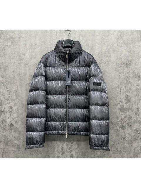 Dior Dior dark grey down jacket with all-over logo embroidery on the sleeve.
