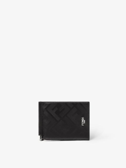 FENDI Flip-cover money clip with interior organized into six card slots. Made of black leather with emboss