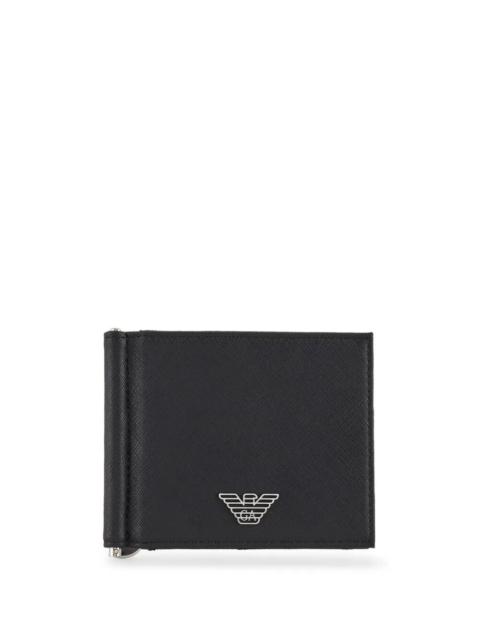 EMPORIO ARMANI The CLASSIC WALLET by EMPORIO ARMANI is an essential accessory for the modern man. Crafted from prem