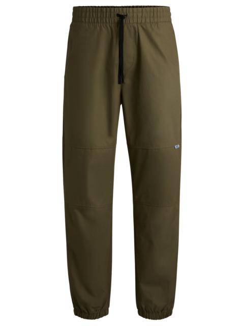 HUGO TAPERED-FIT TROUSERS IN STRUCTURED COTTON