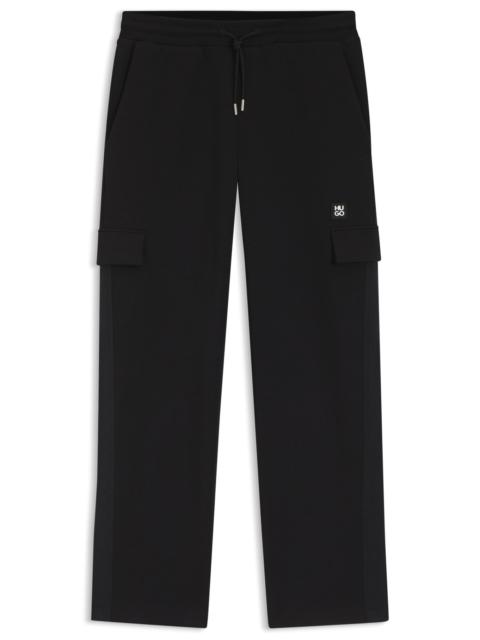 HUGO GEOMETRIC-TAPE TRACKSUIT BOTTOMS IN A COTTON BLEND
