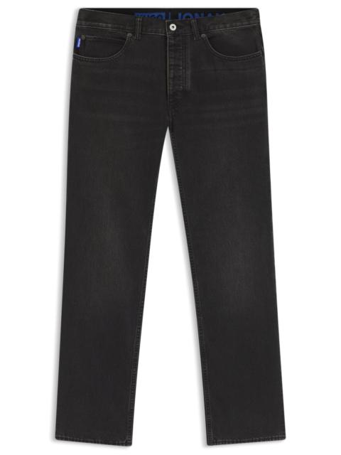 HUGO REGULAR-FIT JEANS IN BLACK WASHED DENIM