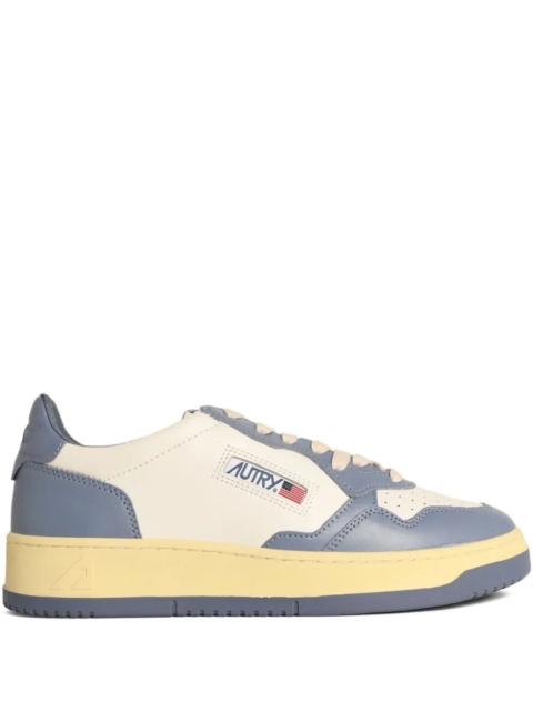 AUTRY Introducing the "MEDALIST LOW" LEATHER SNEAKERS by AUTRY, an exceptional addition to your footwear c
