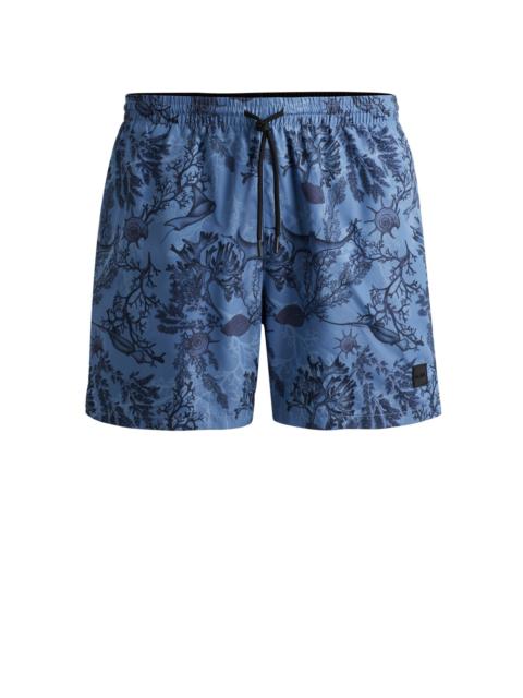 BOSS LOGO-BADGE SWIM SHORTS WITH SEASONAL PRINT