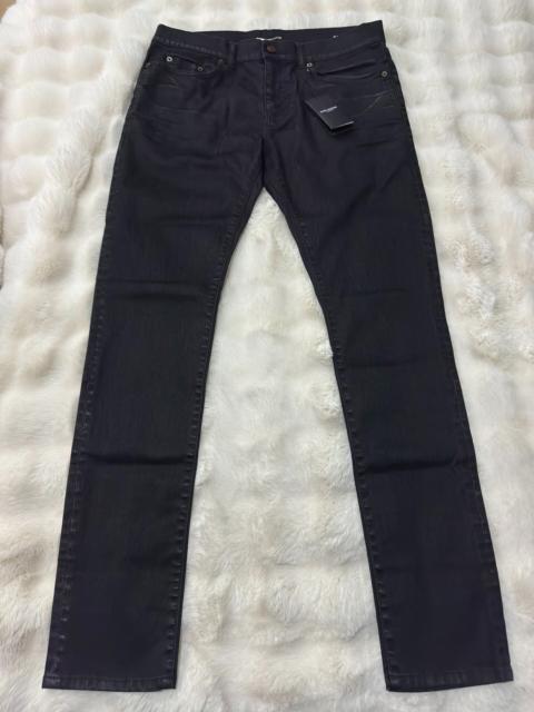 SAINT LAURENT Brand-new Saint Laurent (SLP) rubber-coated denim jeans from the 2023 runway collection.
