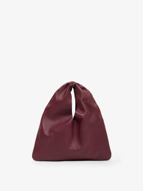 The Row Bindle small burgundy leather bag