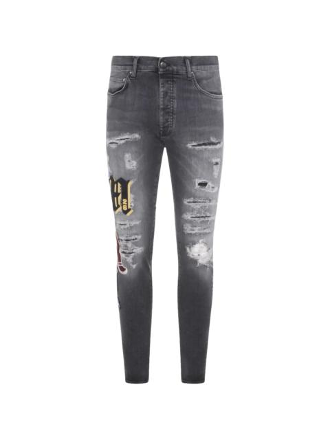 AMIRI Amiri Ripped Patch Skinny Jeans