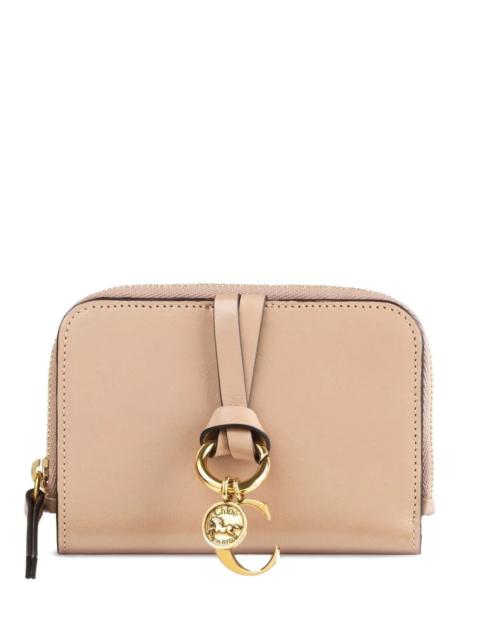 Chloé Introducing the "ALPHABET" SMALL WALLET by CHLOE, a luxurious accessory that epitomizes elegance. Cr