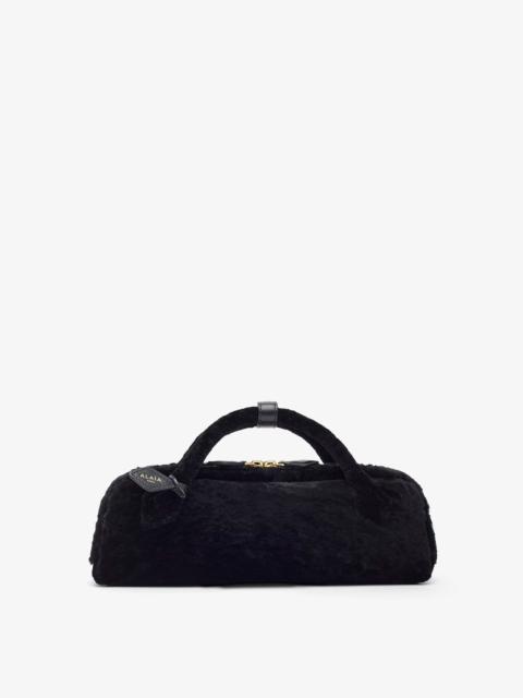 Alaïa Le Teckel black shearling clutch