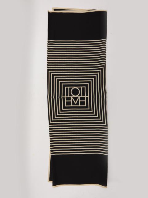 Toteme Centered Monogram Scarf In Black