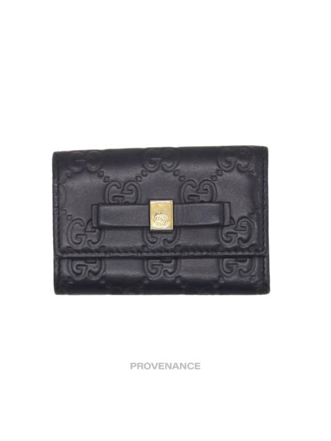 GUCCI Gucci Bow 6 Key Holder - Black Guccissima Leather Gold