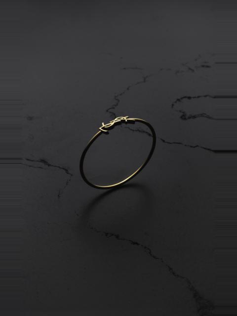 SAINT LAURENT CASSANDRE HINGED BANGLE IN 18K YELLOW GOLD
