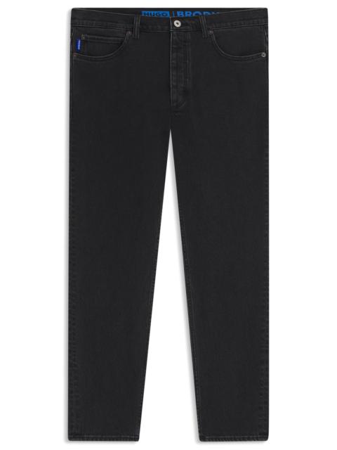 HUGO TAPERED-FIT JEANS IN GRAIN-EFFECT BLACK DENIM