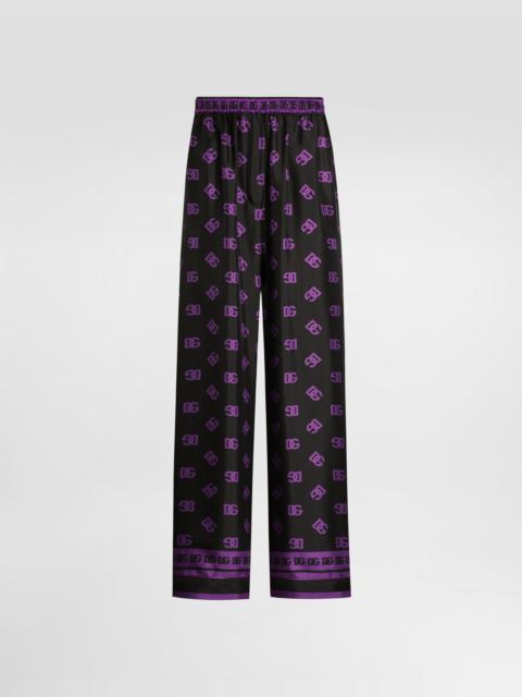 Dolce & Gabbana DG logo all-over print silk vanity pants
