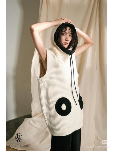 Louis Vuitton Louis Vuitton LV off-white sleeveless knitted top with detachable hood.