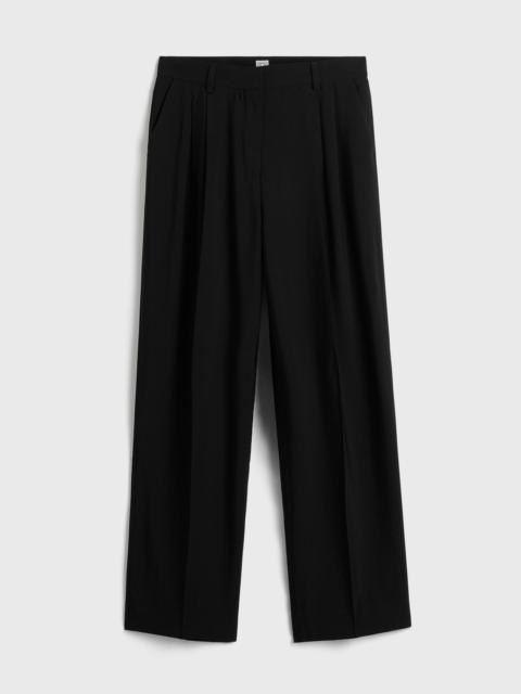 TOTEME Double-pleat fluid trousers black