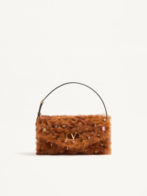 Valentino VALENTINO GARAVANI DEVAIN SMALL SHOULDER BAG IN LAMB FUR WITH RHINESTONES.